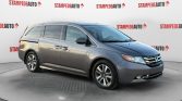 2014 Honda Odyssey Touring | LEATHER | POWER/HEATED SEATS | SUNROOF | POWER SLIDING DOORS | POWER HATCH | REAR ENTERTAINMENT | DUAL CLIMATE CONTROL | REAR CLIMATE CONTROL | REMOTE START | USB PORT | Stampede Auto